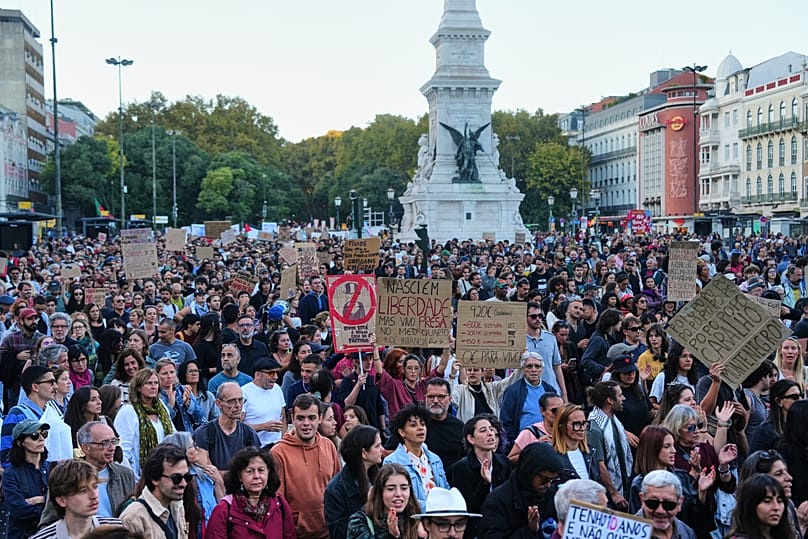 People march during a protest to demand affordable housing in Lisbon, Portugal, Saturday, Oct. 24, 2026. (AP Photo/Ana Brigida)