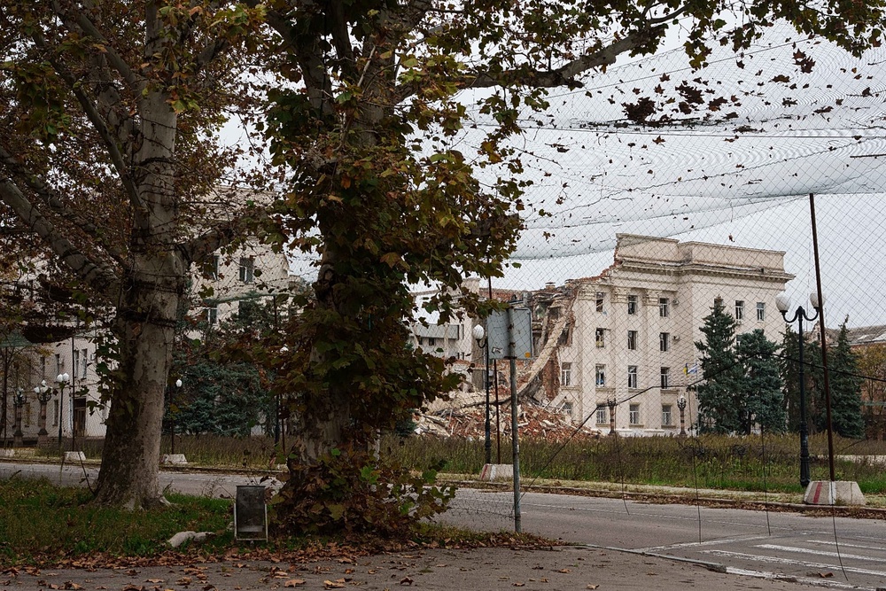 Anti-drone nets stretched over a street during a local ceasefire linked to efforts to evacuate residents of Oleshky, in Kherson, Ukraine, Tuesday, Oct. 27, 2026.