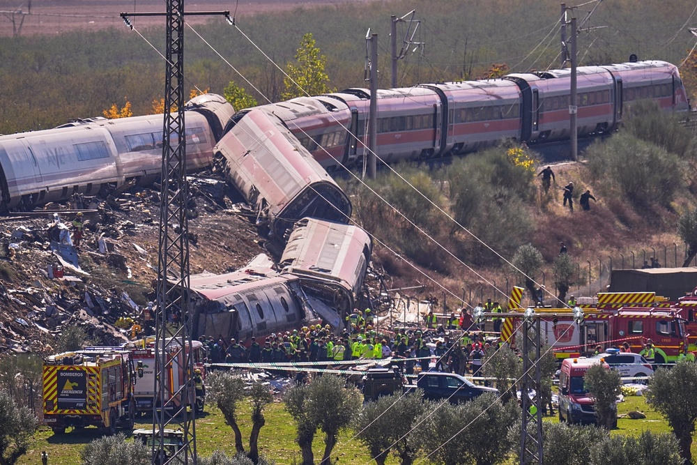 Emergency services work at the site of a collision between two trains in Urda, Spain, on Wednesday 28 October 2026. (AP Photo/Manu Fernández)