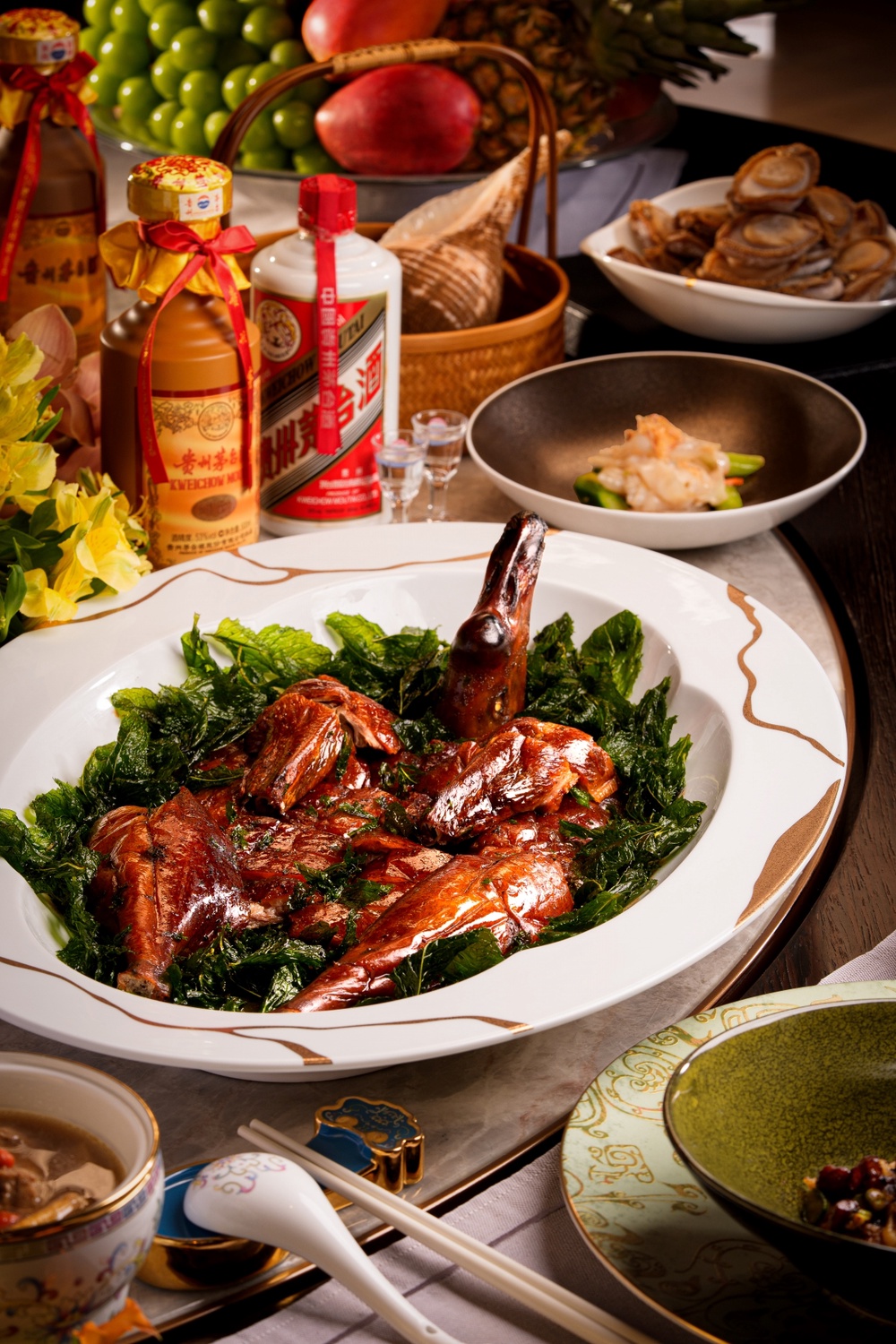 Roasted Goose with Fermented Black Bean and Mint alongside House of Origin Abalone infused with Moutai aromas, thoughtfully paired with rare aged Moutai, celebrating the timeless artistry and elegance of Cantonese gastronomy at