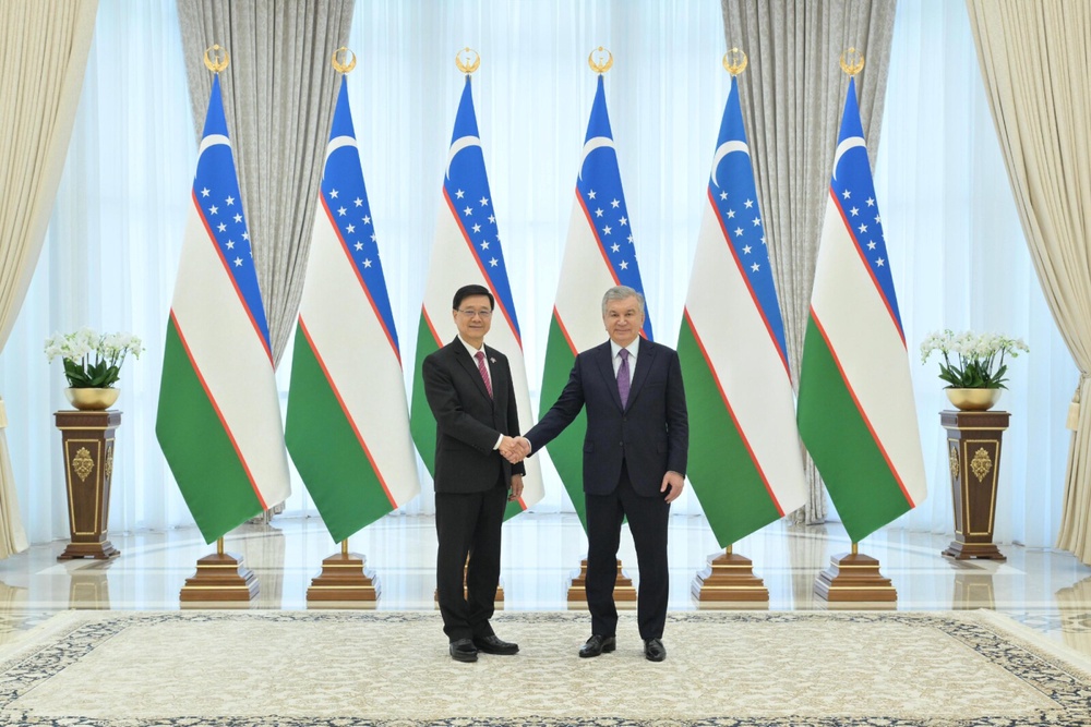 Hong Kong SAR's Chief Executive, John Lee (left) meets with the President of Uzbekistan, Shavkat Miromonovich Mirziyoyev.