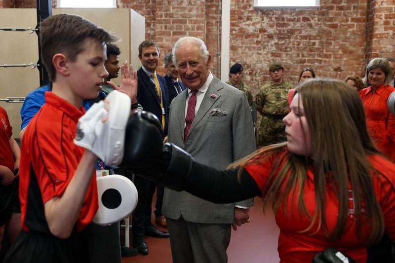 Image from: 'I have my uses': King jokes with schoolgirl who skipped maths class for royal visit