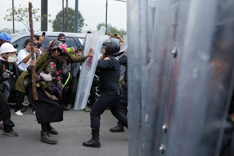 Image from: World Cup chaos as rampaging protesters fight police and man suffers heart attack outside stadium