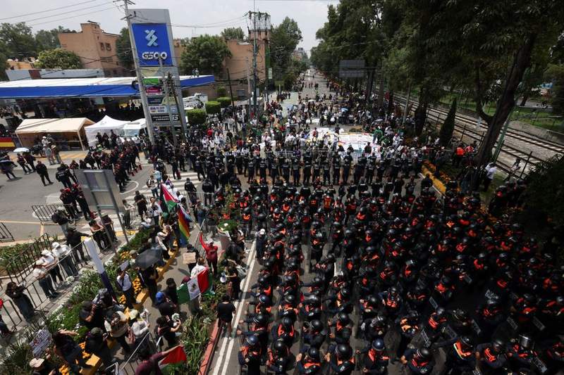 Image from: World Cup chaos as rampaging protesters fight police and man suffers heart attack outside stadium