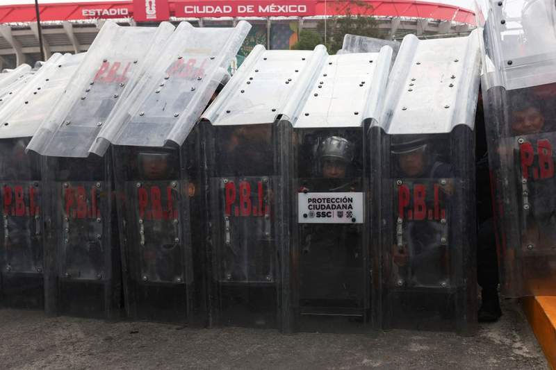 Image from: World Cup chaos as rampaging protesters fight police and man suffers heart attack outside stadium