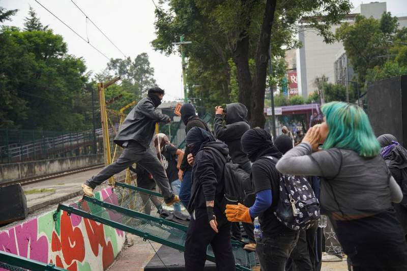 Image from: World Cup chaos as rampaging protesters fight police and man suffers heart attack outside stadium