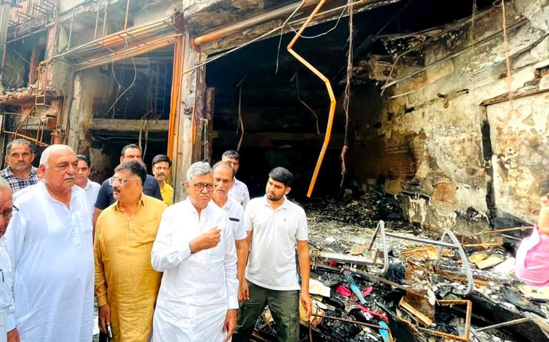 Image from: Rohtak fire tragedy: Bhupinder Hooda meets affected traders, demands enhanced relief