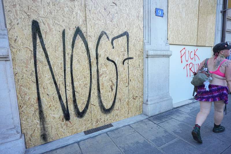 Image from: Tear gas and Tesla on fire as thousands march in Geneva to protest G7
