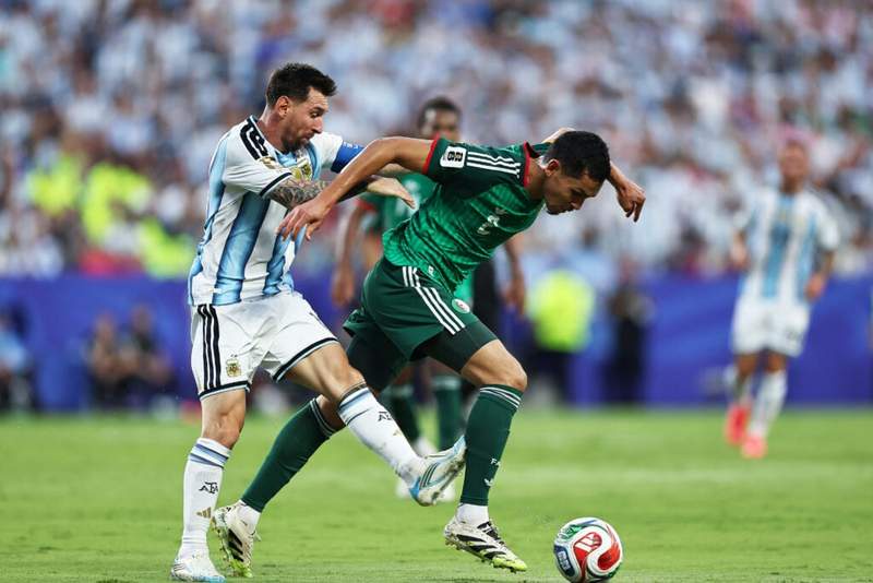 Image from: Soccer fans slam VAR blunder after Lionel Messi avoids booking for horrendous tackle vs Algeria