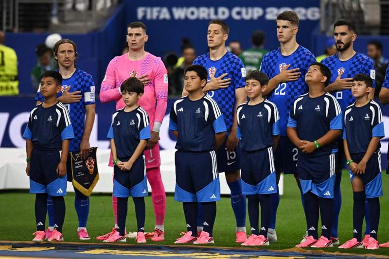 Image from: Why some teams stand sideways to sing the national anthem at the World Cup