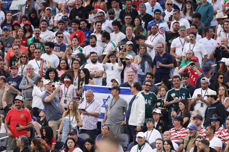 Image from: Soccer fan who had Israeli flag confiscated at Iran World Cup game has spoken out