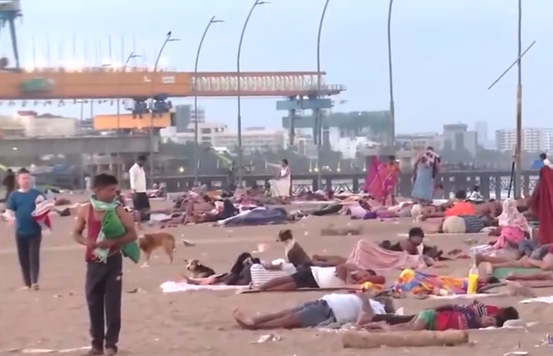 Image from: Mumbai residents sleep on Versova beach to escape extreme heat