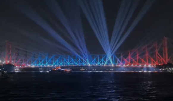 Image from: Howrah Bridge lights up ahead of International Yoga Day celebrations in Kolkata