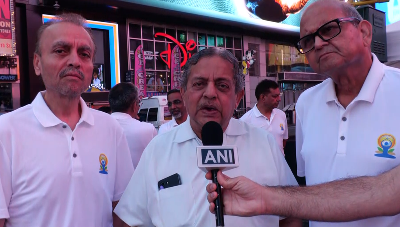 Image from: US: Om chants echo across Times Square in New York on International Yoga Day