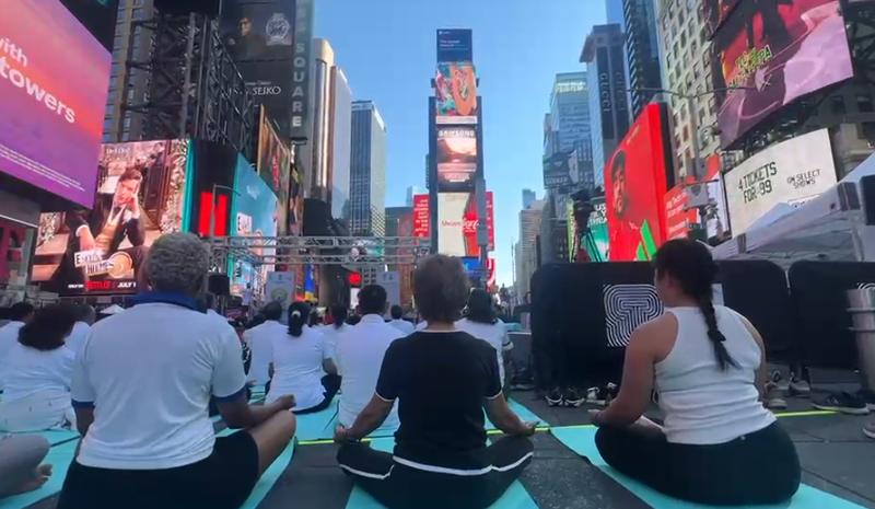 Image from: US: Om chants echo across Times Square in New York on International Yoga Day