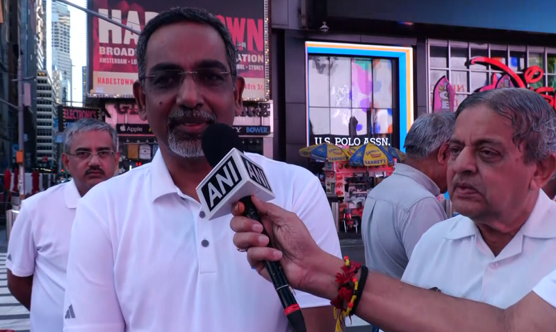 Image from: US: Om chants echo across Times Square in New York on International Yoga Day