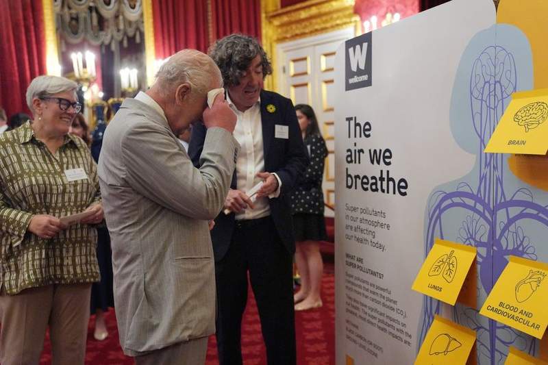 Image from: Royal aide holds electric fan for King Charles as monarch refuses to let heatwave slow him down