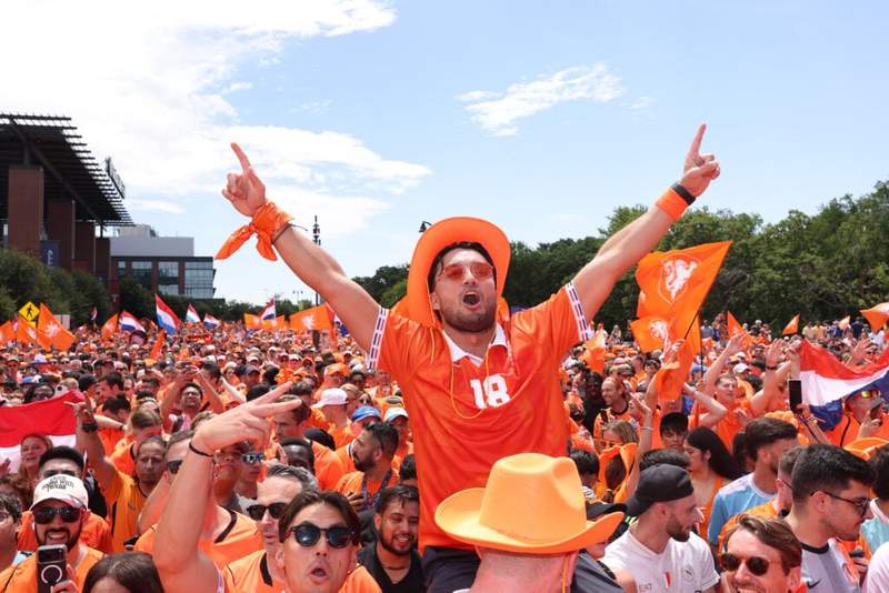 Image from: Americans invited to join ‘legendary’ Orange Walk by Netherlands fans during World Cup