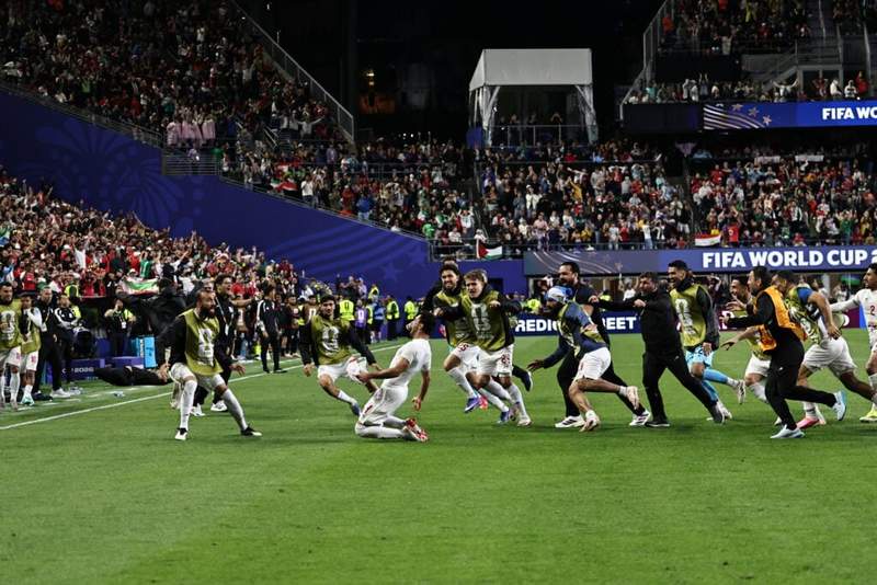 Image from: US stewards tackle fan after pitch invasion during Iran vs Egypt World Cup game