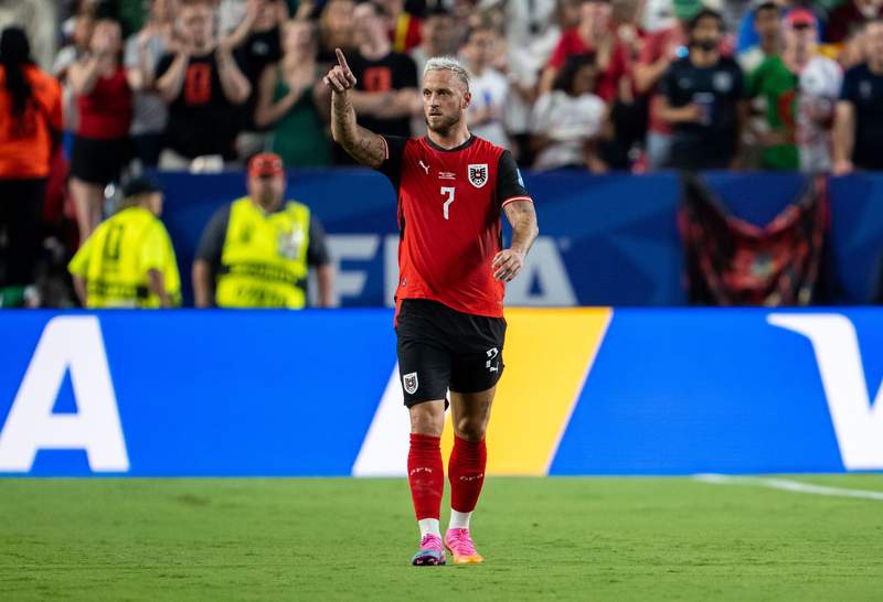 Image from: Austria and Algeria into knock-outs after dramatic draw