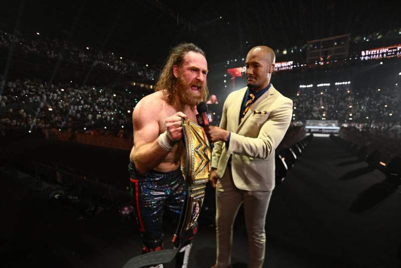 Image from: Kevin Owens and Becky Lynch as Sami Zayn finally wins the WWE title at Night of Champions
