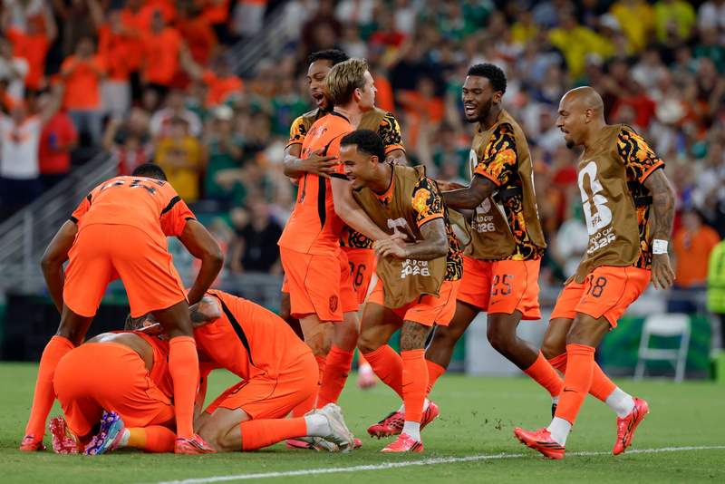 Image from: Morocco into last 16 after dramatic shoot-out win against Netherlands