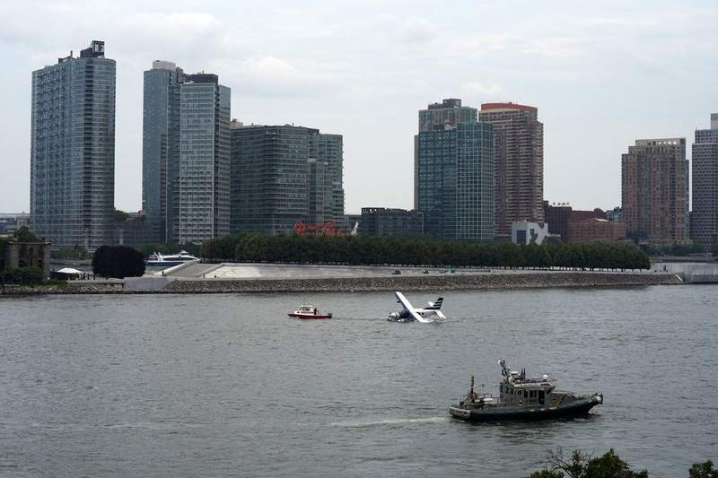 Image from: Horror as seaplane crash-lands in New York river with eight people on board