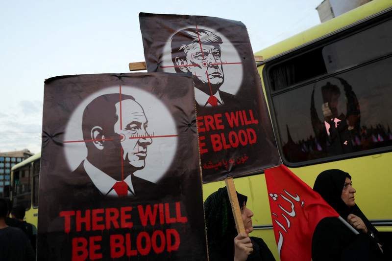 Image from: Mourners carry 'Kill Trump' banners at Khamenei's funeral procession; Eulogist calls for Trump's death