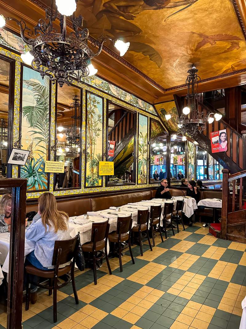 Image from: In Paris, this restaurant where Kate Moss is a regular has been around since 1880 (and the table at the back remains the most coveted)