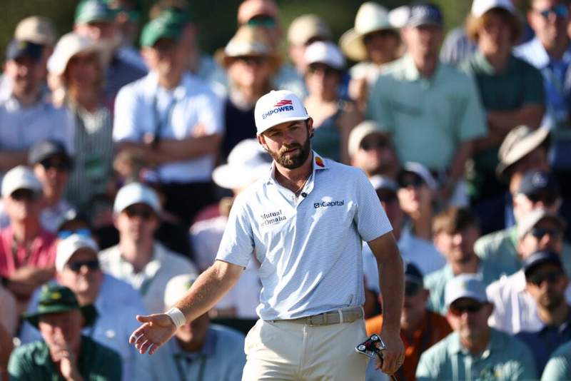 Image from: What Cam Young’s caddie was doing on Sunday at The Masters claimed to have stopped him from winning