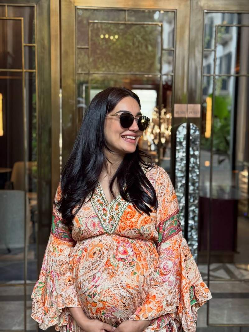 Image from: Surbhi Jyoti flaunts her baby bump in a flowy printed dress