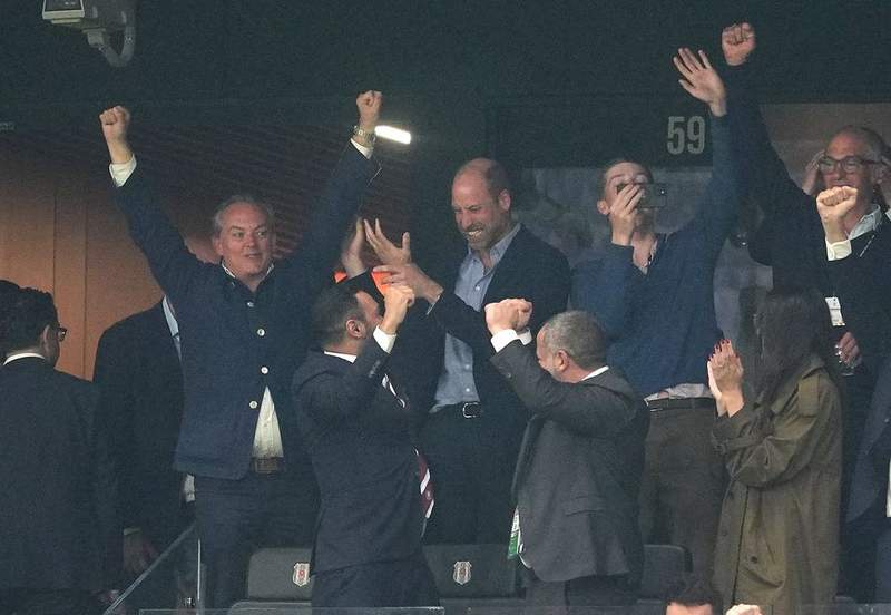 Image from: William swipes away phone call during Aston Villa celebrations