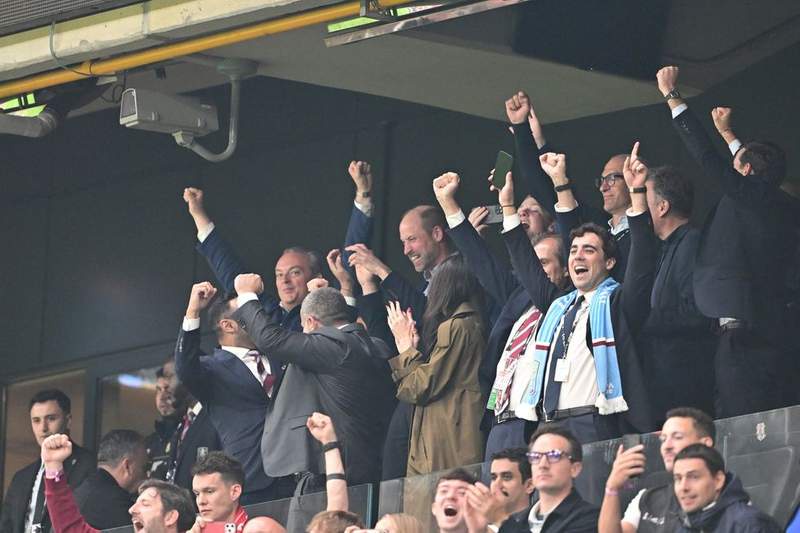 Image from: William swipes away phone call during Aston Villa celebrations