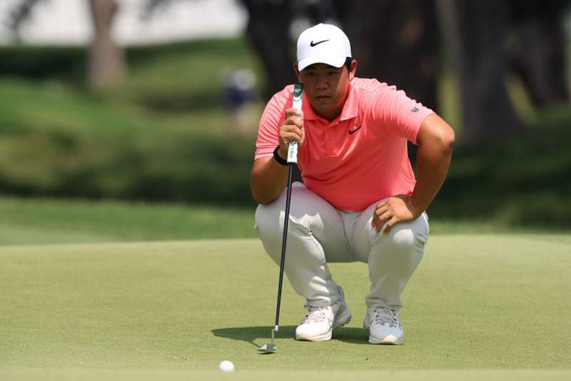 Image from: Tom Kim reacts after sitting top of the leaderboard on the PGA Tour for the first time in two years