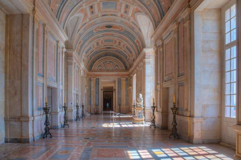 Image from: In Portugal, this monumental Baroque palace tells the story of a king’s madness – and houses 36,000 books protected by bats