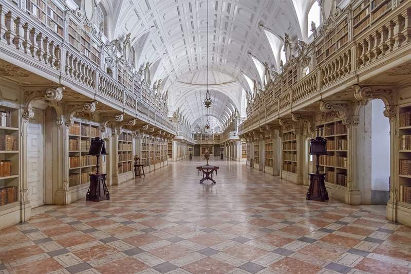 Image from: In Portugal, this monumental Baroque palace tells the story of a king’s madness – and houses 36,000 books protected by bats