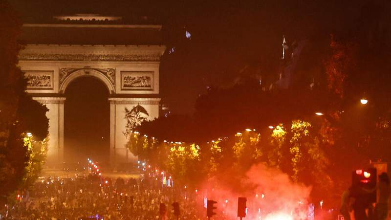 Image from: PSG players parade Champions League trophy at Eiffel Tower after night of unrest in Paris