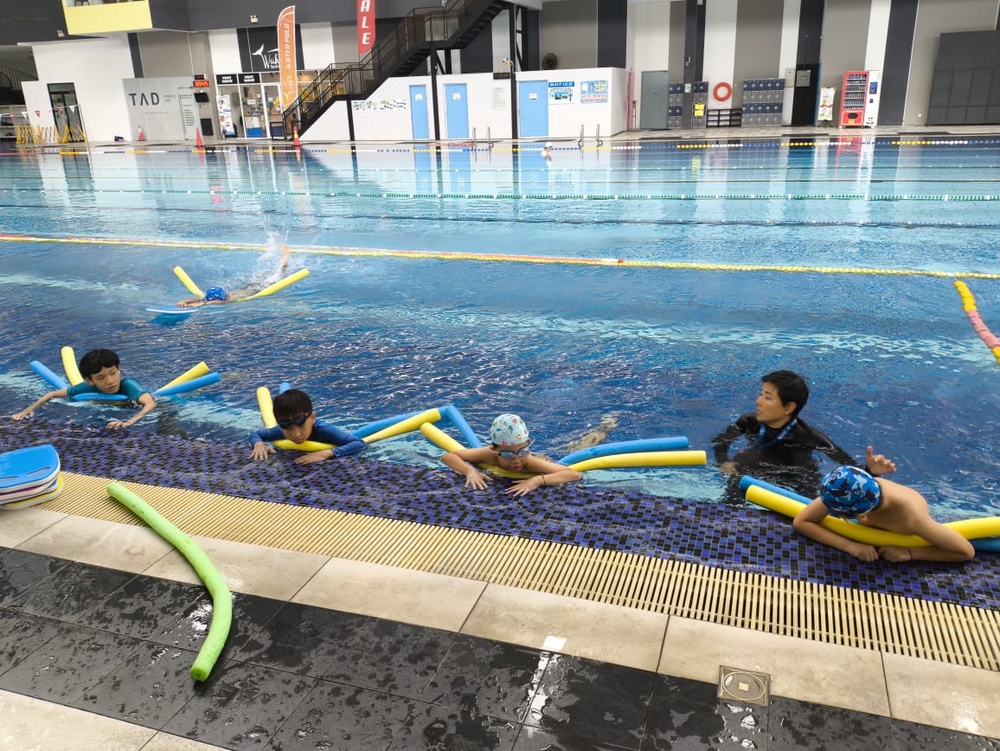 Image from: Ex-pupil takes time off for free swimming lessons at former school