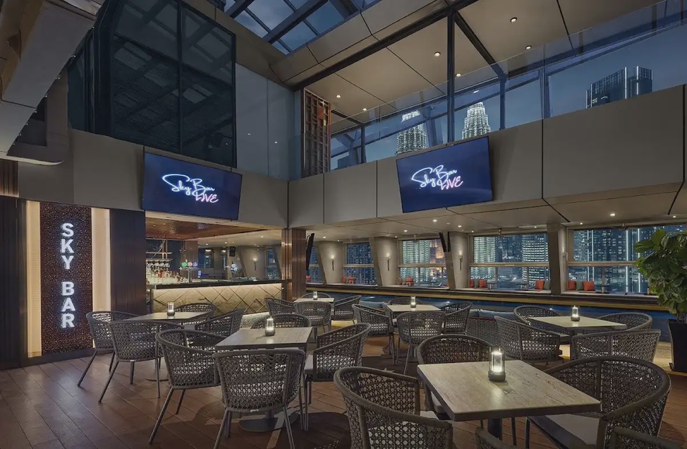 SkyBar Kuala Lumpur Traders Hotel rooftop pool bar arched windows Twin Towers