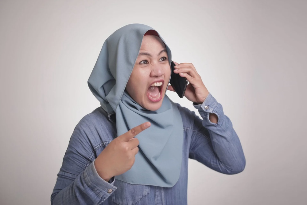 muslim woman angry phone scolding 123rf