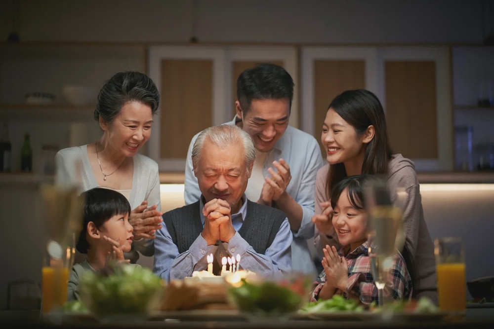 123RF happy three generation asian family celebrating grandpas birthday at home