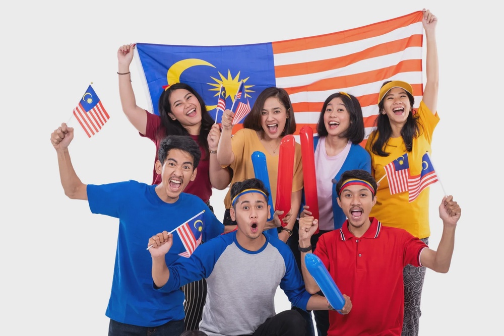 123rf malaysian people holding malaysia flag celebrating independence day