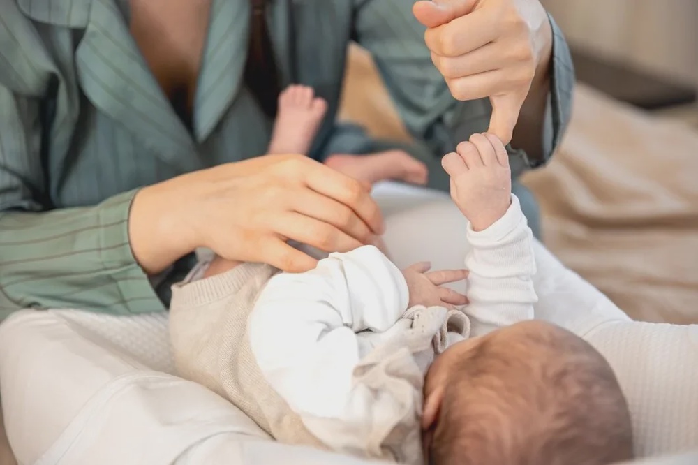 mother plays with newborn baby newborn baby 169016 63679