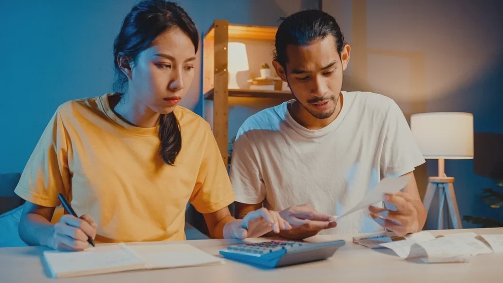 stress asian couple man woman use calculator calculate family budget 7861 2969