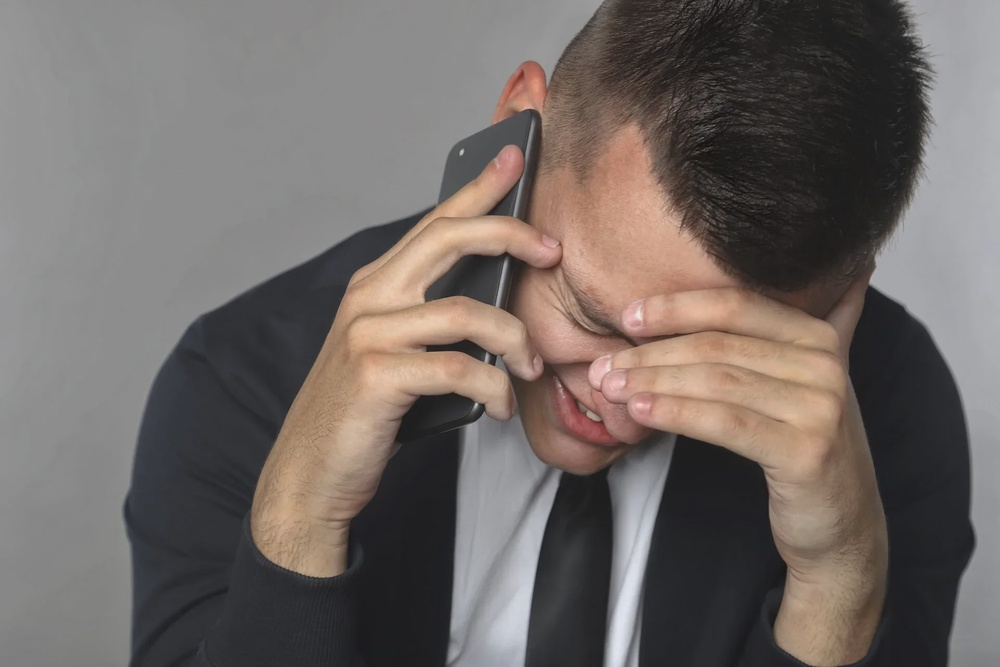 man emotional sad depressed stressed phone call 123rf