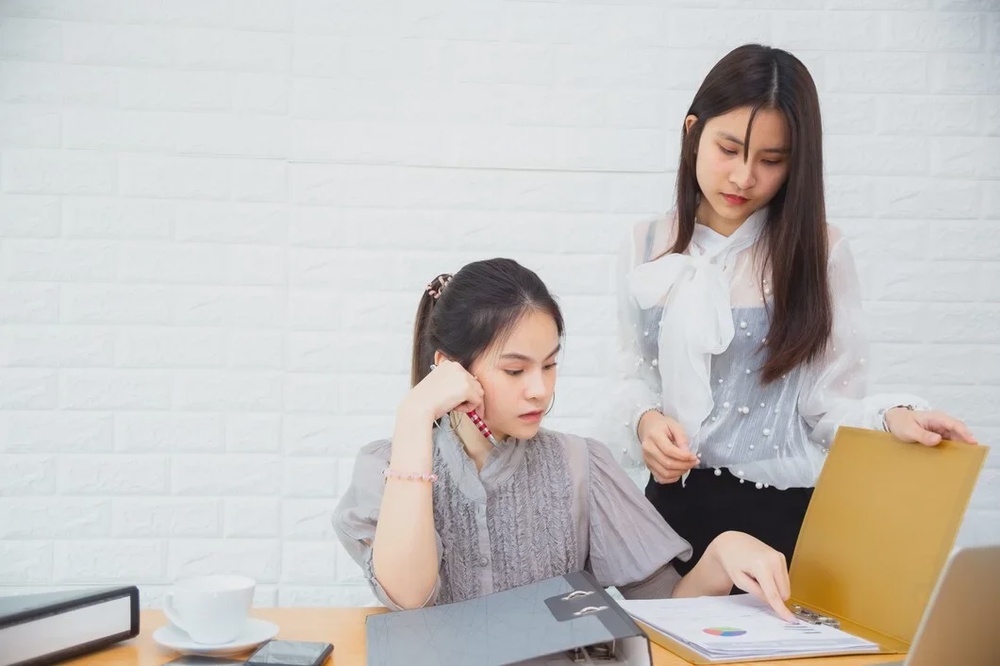 two women working office 1150 14250