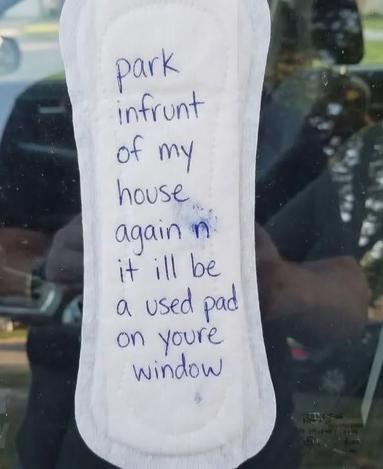 car parked in front of house house owner warns driver leaving a pad