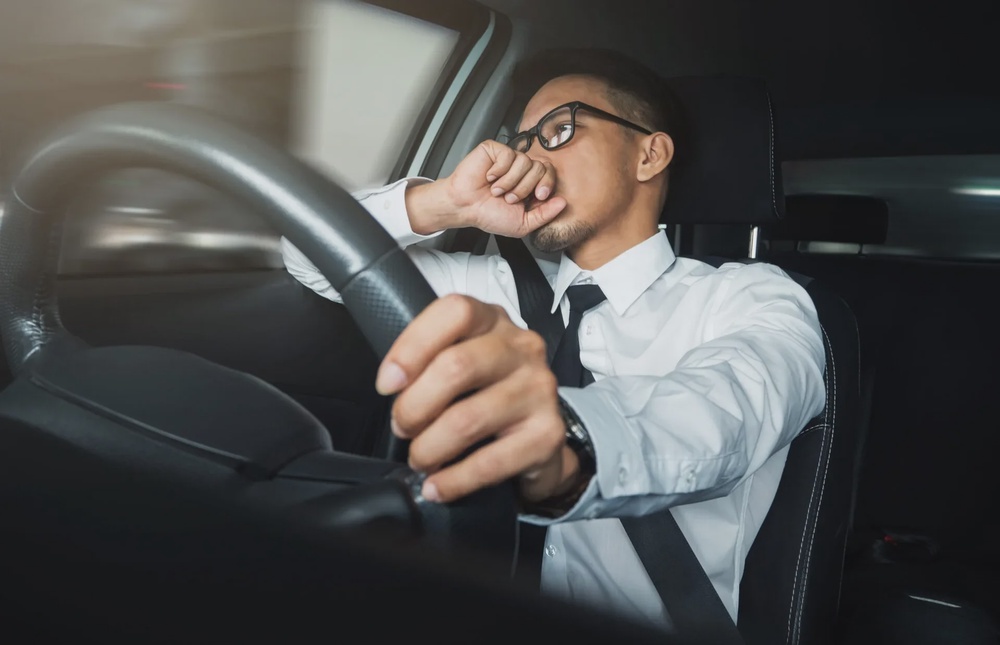man in car