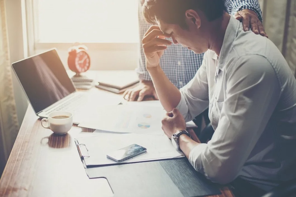 serious young businessman looking financial report seem like 1150 832