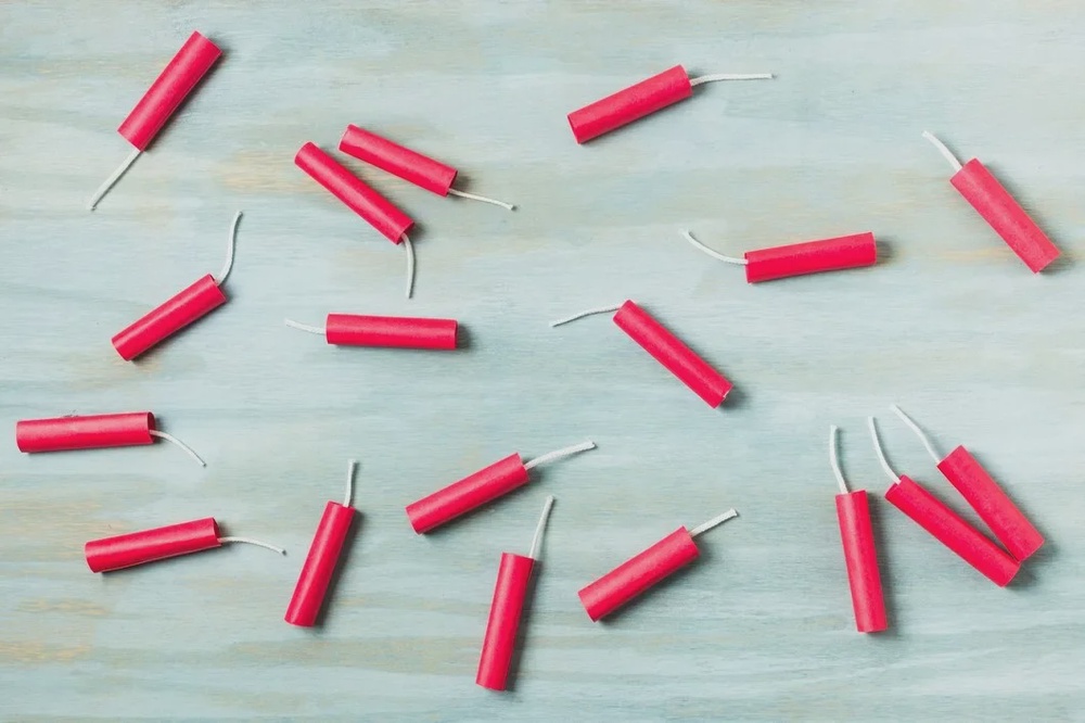 red dynamite firecrackers blue wooden textured background 23 2148160961
